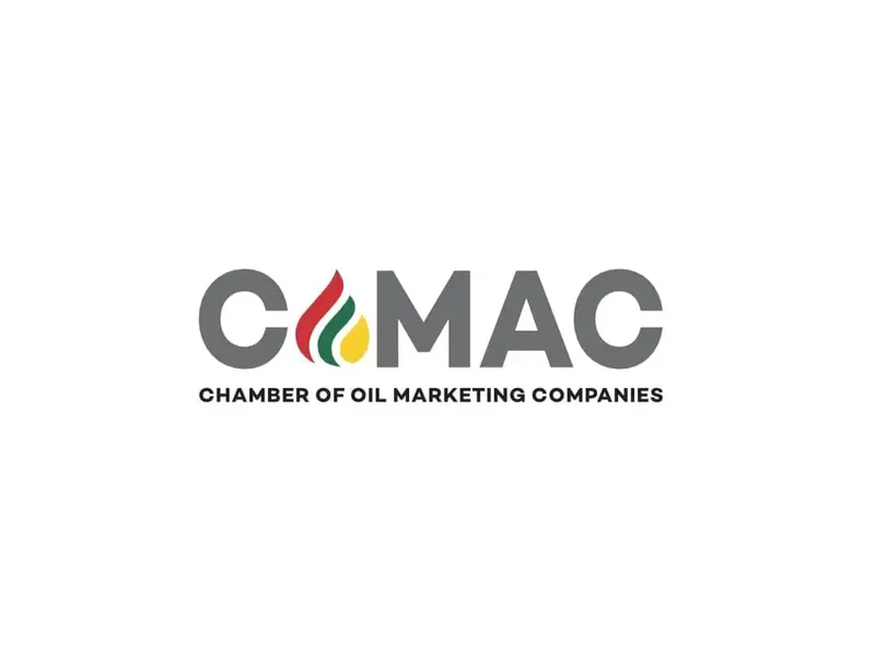 The image shows the official logo of COMAC, the Chamber of Oil Marketing Companies. The logo features 'COMAC' in large grey letters with a stylized flame icon in the red, green, and gold colors of the Ghana flag, followed by the full organization name in black text below.