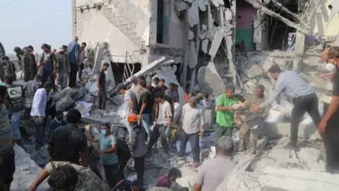 Mehr News/WANA via Reuters People looking for survivors in the rubble of the school in Minab