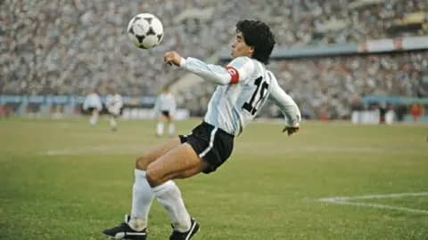Getty Images Maradona mid-play during the 1986 world cup (1986 FIFA World Cup qualifying match against Peru at the National Stadium on June 23)