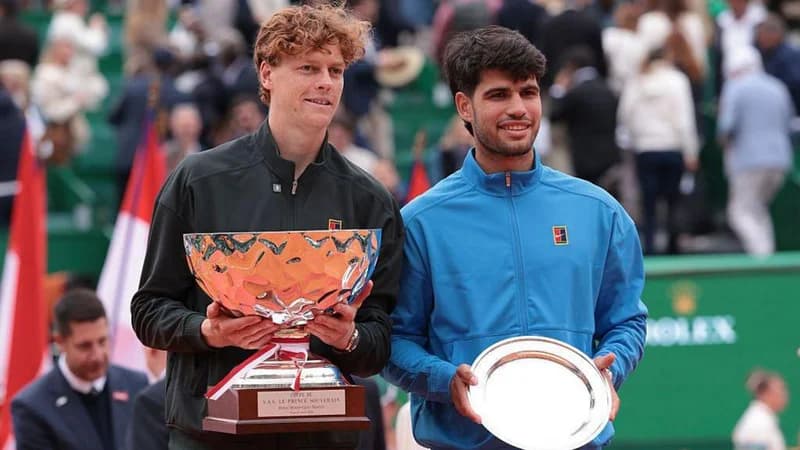 Jannik Sinner and Carlos Alcaraz hold trophies at the Monte Carlo Open
