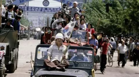 Getty Images Protesters comandeering military vehicles during the Gwangju Uprising in May 1980