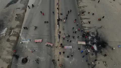Getty Images Aerial view shows demonstrators blocking a road during a protest against the government in El Alto