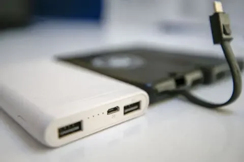 Anadolu Agency/Getty Images White and black portable chargers.