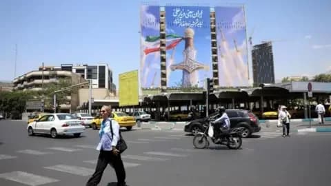 Reuters A large billboard in Tehran which people drive and walk past