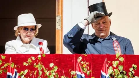 Per Ole Hagen/Getty Images A man and woman on a platform in front of Norwegian flags