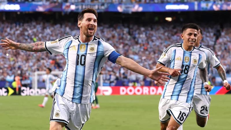 Lionel Messi celebrates scoring the first goal during Argentina's 3-0 win over Algeria
