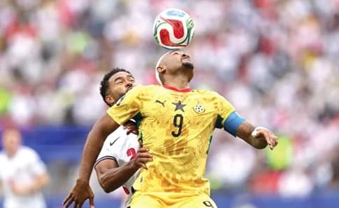 Ghana’s Jordan Ayew wins an aerial battle against Reece James of England during yesterday’s game