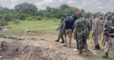Brigadier General Maxwell Obuba Mantey, the Director-General of NACOC, setting the seized drugs ablaze (inset)
