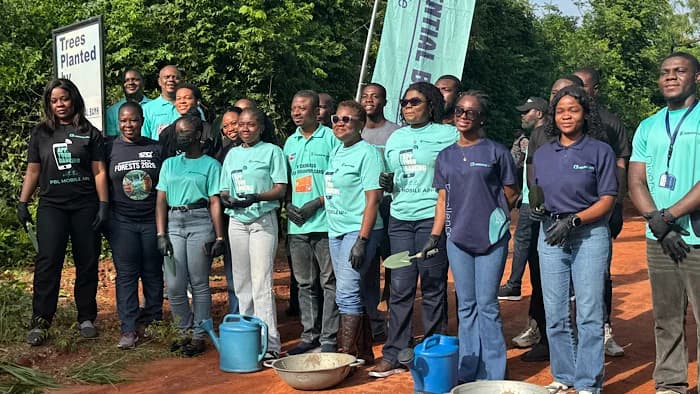 Staff of Prudential Bank Limited and officials of the Forestry Commission pose for a group photograph