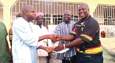 Alhassan Seidu Alajor (right), MP for Chereponi, presenting the keys of a CHPS compound at Adali to Yakubu Abdul-Rahama, District Director of Health Services. With them is Sheini Kofi Amadu (2nd from right), DCE for Chereponi