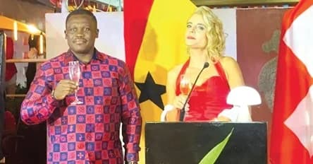 Samuel Nartey George (left) with Simone Giger proposing a toast at the 735th National Day celebration programme
