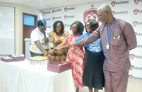 Prof. Monica Mensah Danquah (2nd from left), Professor of Information Science, Department of Information Studies, University of Ghana, Legon; Lydia Nyantakyi-Baah (3rd from right), University Librarian, UniMAC, and Professor Christiana Hammond (2nd from right), Rector of Institute of Journalism, UniMAC, jointly cutting the cake to officially launch the 2026 Maiden Library Week celebration