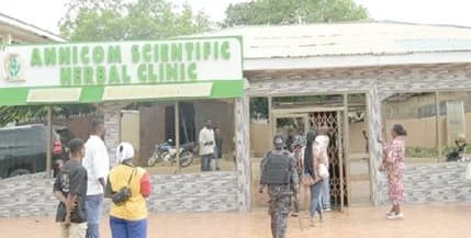 Officials of TMPC locking up Annicorn Scientific Herbal Clinic, one of the affected facilities, during the exercise