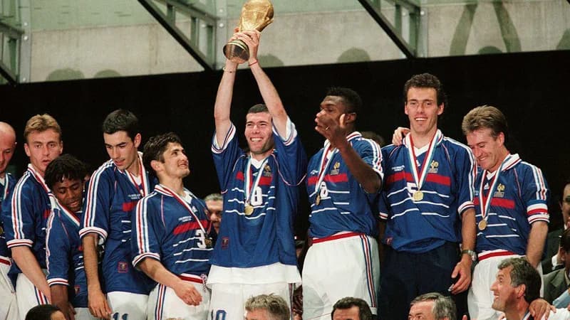 Zinedine Zidane holds the World Cup aloft in 1998 with captain Didier Deschamps among the France team-mates surrounding him