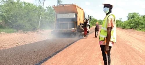 The return of heavy construction equipment and workers to the road has renewed hope among residents