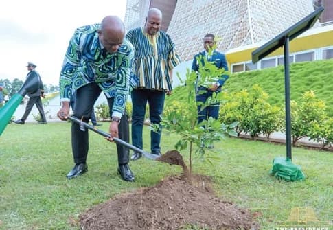 President Brice Clotaire Oligui Nguema planting a tree at the Jubilee House while President John Mahama looks on