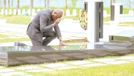 President Brice Clotaire Oligui Nguema paying homage to former President Jerry John Rawlings at the military cemetery
