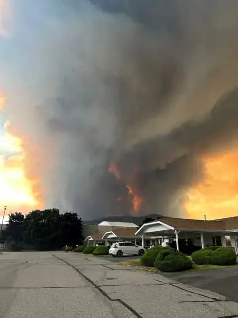 Reuters Smoke rises from the Bald Range wildfire over a residential street in Summerland