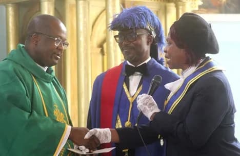 Respected Lady Sis. Cynthia Prah (right), the Regional Noble Lady, presenting a gift to Very Rev. Fr Jean De Dieu Ahorloo, SMA. With them is Worthy Brother William Ashaley (middle), the Regional Grand Knight of Accra East Region. Picture: ESTHER ADJORKOR ADJEI