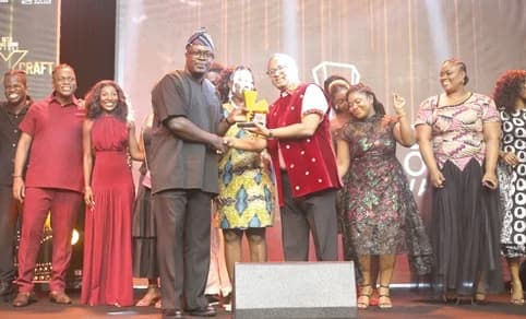 Andrew Ackah (4th from left), President, Advertising Association of Ghana, presenting the Agency of The Year award to Anand Badami (4th from right), Senior Vice-President, Publicis West Africa. Behind them are other staff members of Publicis West Africa. Picture: BENEDICT OBUOBI