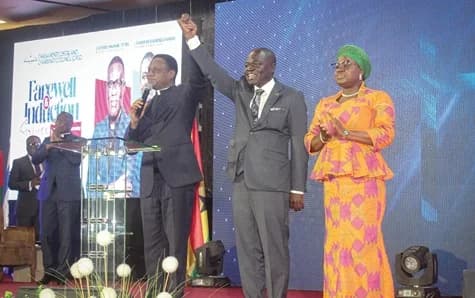 Apostle Eric Nyamekye (left), Chairman, Church of Pentecost Ghana, declaring Dr Ebenezer Gyamera the new GPCC General Secretary. With them is the wife of Dr Gyamera. Picture: ERNEST KODZI