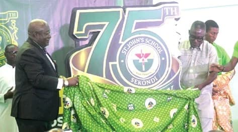Dr Henry Benyah (left), Chairman of the occasion, and Dr Kwesi Enyan (right), Director of Operations at Rocksure International Ltd, unveiling the anniversary logo. Picture: ESTHER ADJORKOR ADJEI