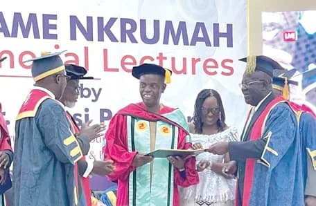 Dr (Sir) Sam Esson Jonah (right), the Chancellor of UCC, presenting certificate of honour to Kwesi Pratt Jr. (3rd from right). With them include Marian Baaba Pratt (2nd from right), wife of the awardee and some UCC management