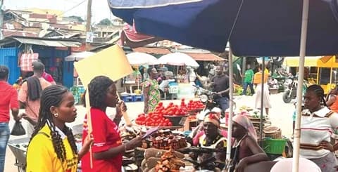 Students from the University of Cape Coast’s Department of Nutrition and Dietetics interact with market women at the Kotokuraba Market in Cape Coast as part of the activities of the proposed mandatory front of package warning label
