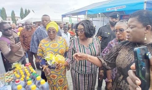 Abla Dzifa Gomashie (left), Minister of Tourism, Culture and Creative Arts, and Rita Akosua Adjei Awatey (middle), Eastern Regional Minister, interacting with exhibitors at the Expo in Koforidua