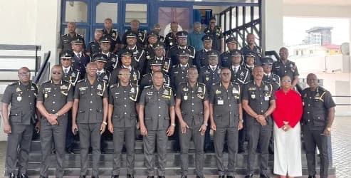 Christian Tetteh Yohuno (middle), Inspector-General of Police, and Commissioner of Police Lydia Yaako Donkor (2nd from right), the Director-General of the CID, and the Police Management Board with the newly promoted police officers