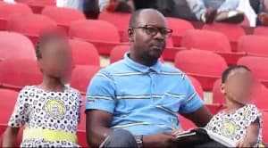 Asante Kotoko supporter attends match with young daughters at Baba Yara