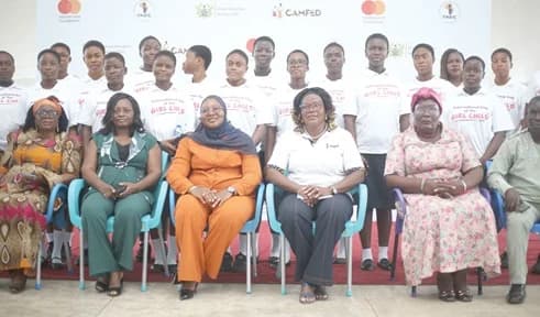 Fairuza Abdul-Rashid Safian (middle), Executive Director, CAMFED Ghana; Habiba Kotonah (left), GES Director, La Dadekotopon; Emelia Ayipio Asamoah (2nd from left), Head, Work Force Development, MasterCard Foundation, and some guests and students of the Labone SHS. Picture: BENEDICT OBUOBI