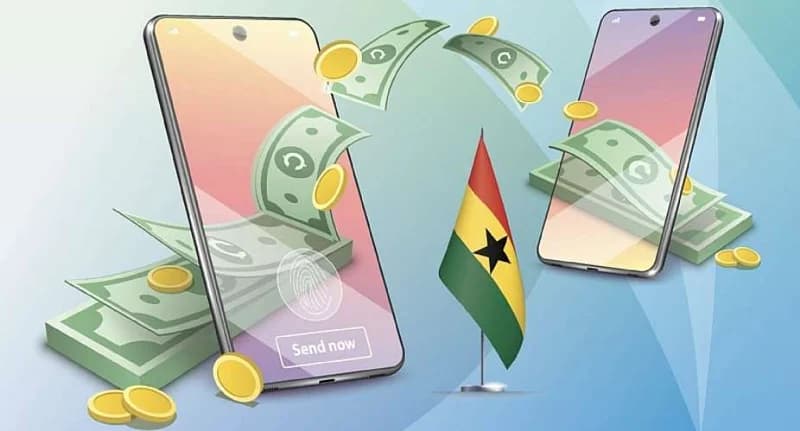 A digital illustration depicting mobile money transfers between two smartphones, featuring floating banknotes and gold coins. A small Ghanaian flag stands in the center, while the foreground phone displays a fingerprint sensor and a 'Send now' button.