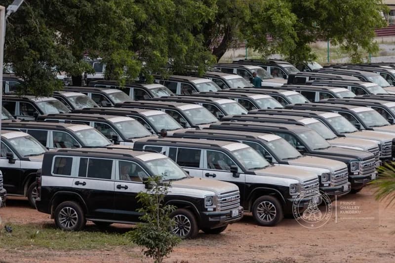 A large fleet of black and white ZondaTech SUVs parked in multiple rows on a dirt lot, prepared for distribution. These vehicles are being presented by the Ministry of Local Government to Metropolitan, Municipal, and District Chief Executives (MMDCEs) in Ghana.